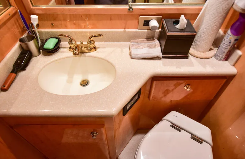 Slide: The Image of Luxurious 2004 Navigator Rival bathroom with elegant sink and gold faucet. - 31