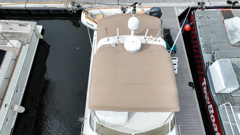 Slide: The Image of Aerial view of a 2004 Navigator Rival yacht docked at a marina. - 5