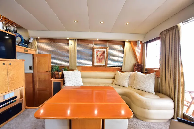 Slide: The Image of Luxurious 2004 Navigator Rival yacht interior with plush seating and elegant wood finishes. - 22