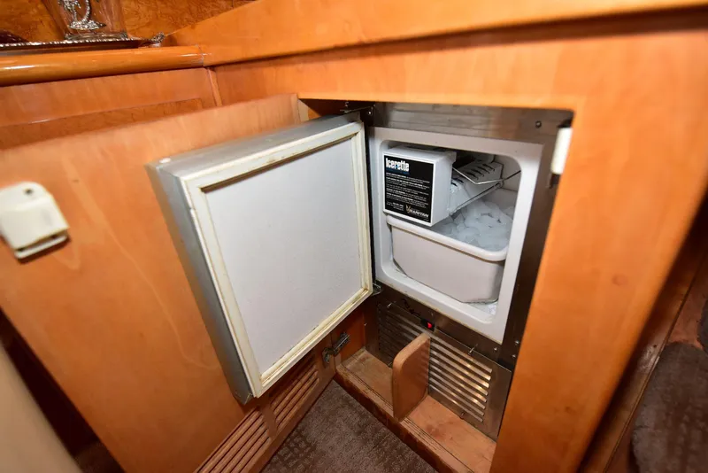 Slide: The Image of Open mini fridge in 2004 Navigator Rival boat interior. - 33