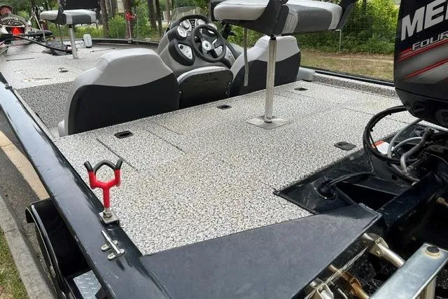Slide: The Image of 2016 Tracker Pro Team 190 TX boat interior with seating and steering console. - 11