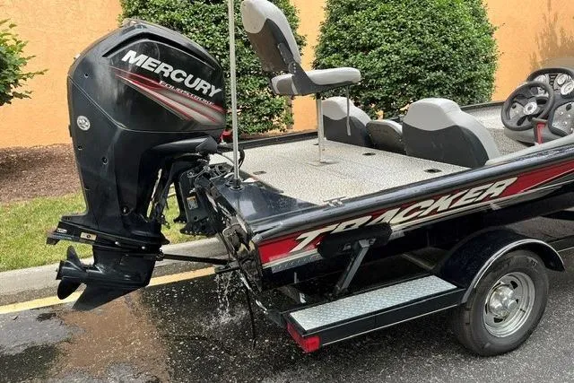 Slide: The Image of 2016 Tracker Pro Team 190 TX boat with Mercury outboard motor, parked outdoors. - 7