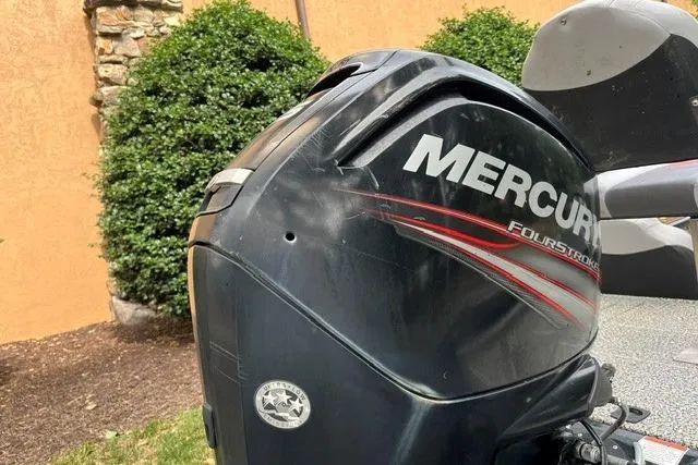 Slide: The Image of 2016 Tracker Pro Team 190 TX with Mercury FourStroke outboard motor, outdoor setting. - 9