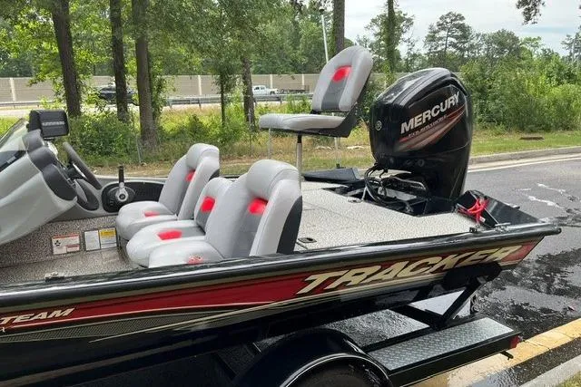 Slide: The Image of 2016 Tracker Pro Team 190 TX boat with Mercury engine, parked on a trailer. - 16