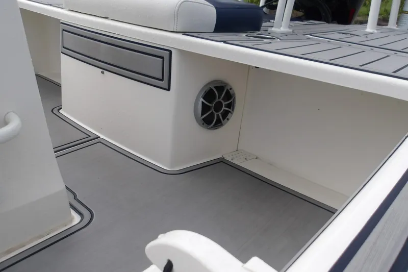 Slide: The Image of 2025 Mako 18 Pro Skiff Patriot Edition interior with speaker and seating detail. - 11