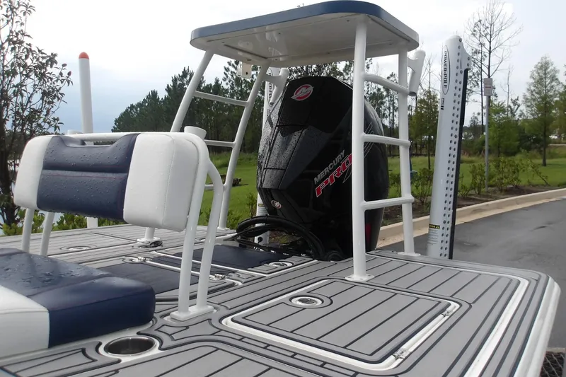 Slide: The Image of 2025 Mako 18 Pro Skiff Patriot Edition with Mercury Pro engine, wet deck view. - 3