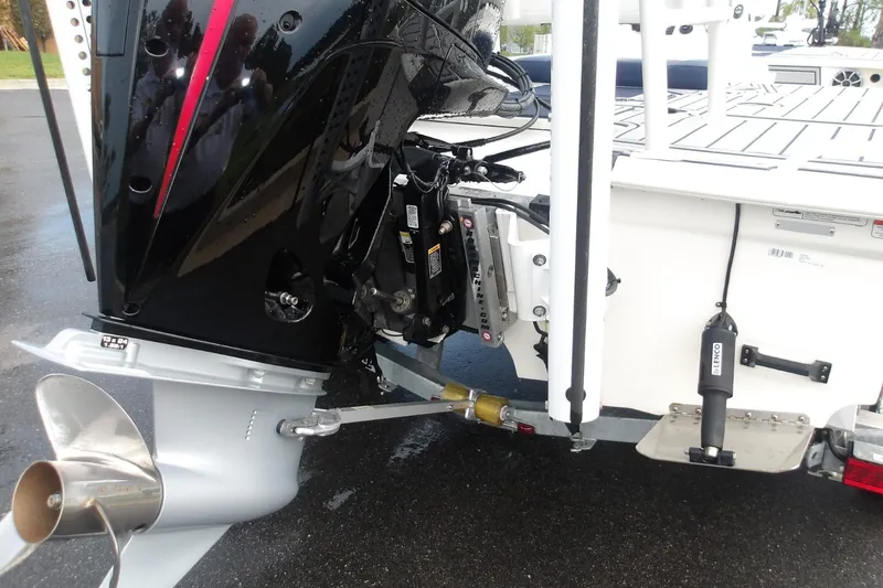 Slide: The Image of 2025 Mako 18 Pro Skiff Patriot Edition boat engine and propeller detail. - 15