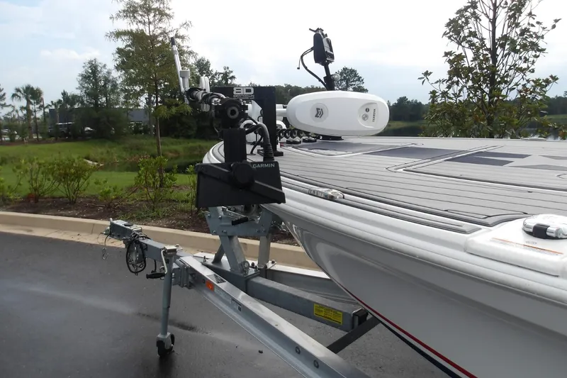 Slide: The Image of 2025 Mako 18 Pro Skiff Patriot Edition on trailer, featuring advanced Garmin equipment. - 9