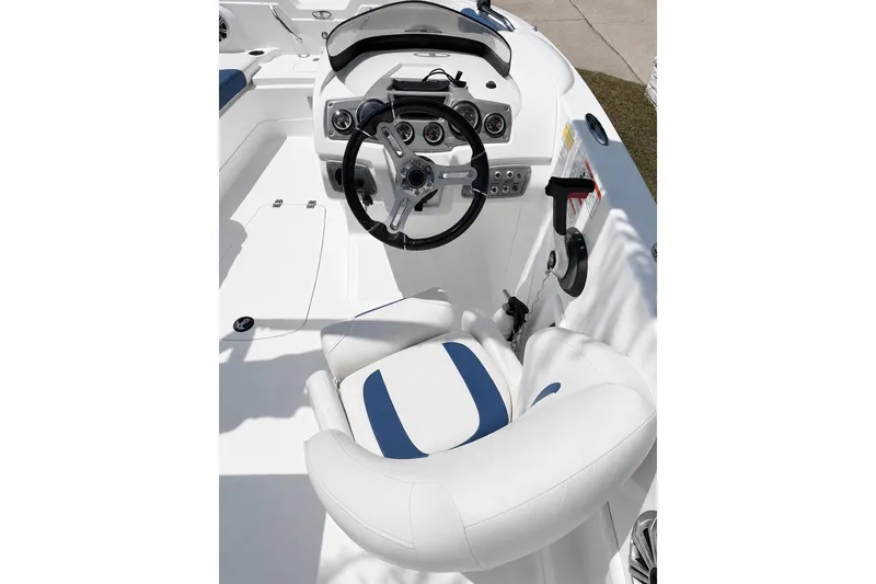 Slide: The Image of Cockpit of 2019 Tahoe 1950 boat with white and blue seating. - 3