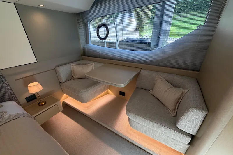 Slide: The Image of Luxurious interior of a 2018 Princess F55 yacht with cozy seating and elegant decor. - 17