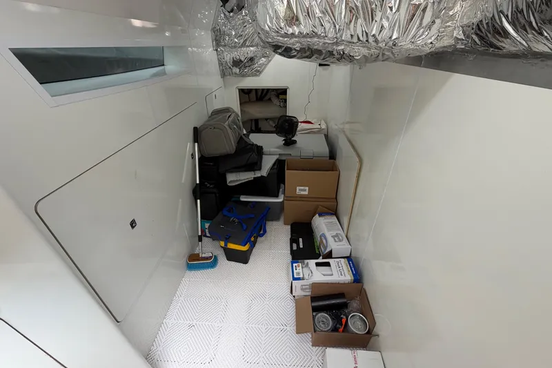 Slide: The Image of Storage area in a 2018 Princess F55 yacht with boxes and equipment. - 29