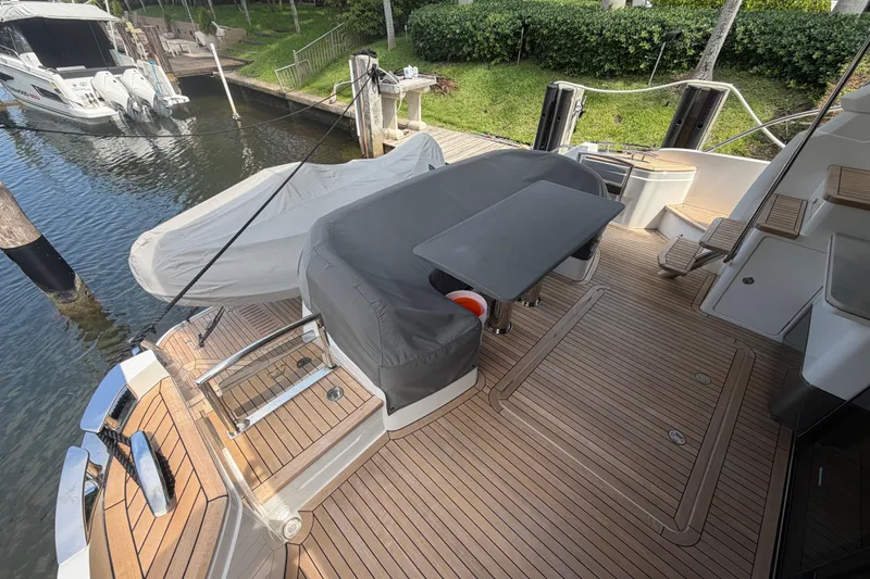 Slide: The Image of Luxury yacht Princess F55 2018 model with covered seating area on deck. - 4