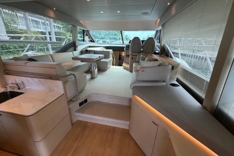 Slide: The Image of Luxurious interior of 2018 Princess F55 yacht with modern seating and panoramic windows. - 6