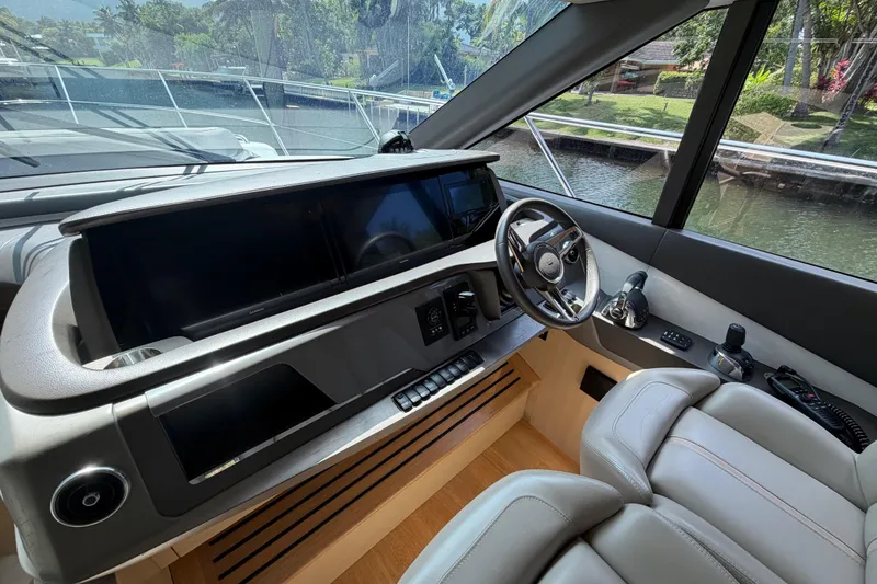 Slide: The Image of Helm of 2018 Princess F55 yacht with modern controls and luxurious seating. - 13