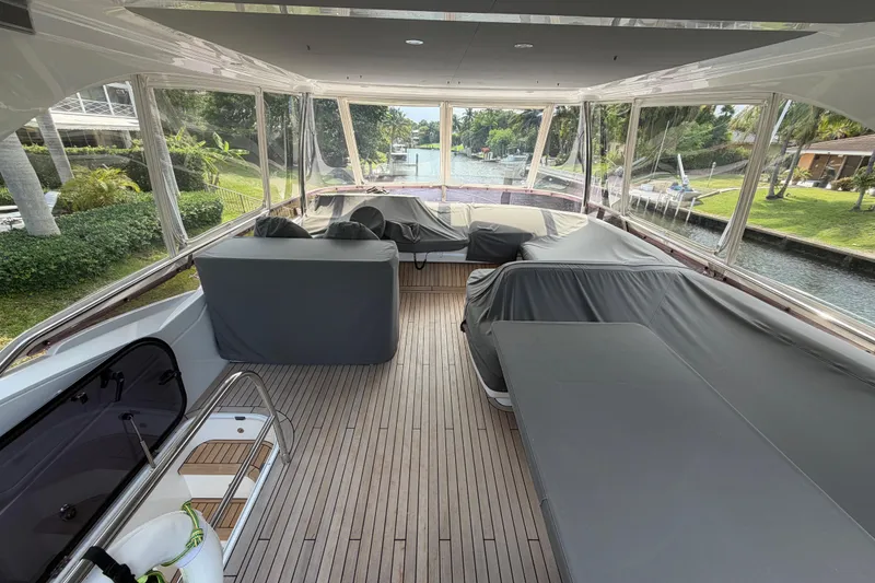 Slide: The Image of Spacious deck of 2018 Princess F55 yacht with covered seating and scenic canal view. - 24