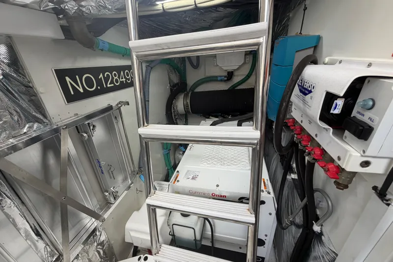 Slide: The Image of Engine room of 2018 Princess F55 yacht with Cummins Onan generator and Reverso oil change system. - 30