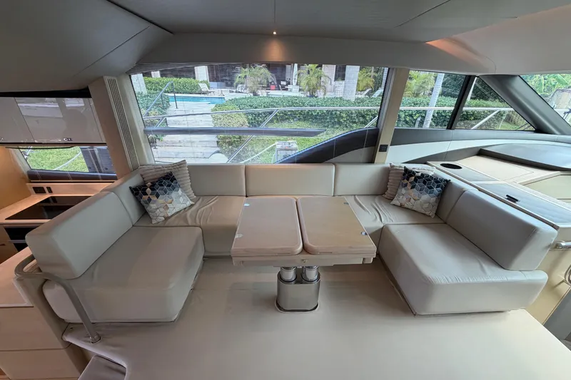 Slide: The Image of Luxurious interior of a 2018 Princess F55 yacht with elegant seating and table. - 9