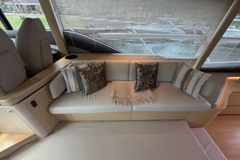 Slide: The Image of Luxurious interior of 2018 Princess F55 yacht with elegant seating and decorative pillows. - 10