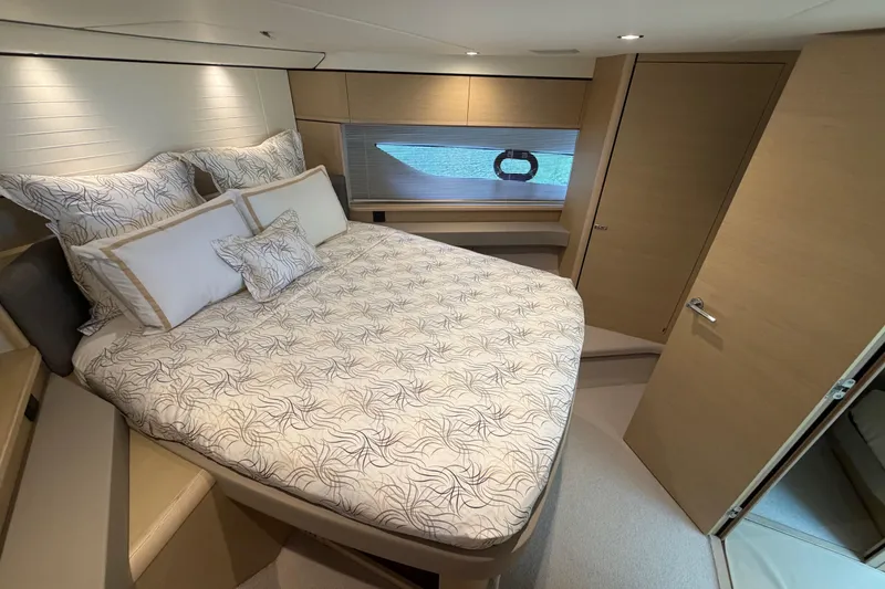 Slide: The Image of Luxurious 2018 Princess F55 yacht bedroom with elegant bedding and modern design. - 20