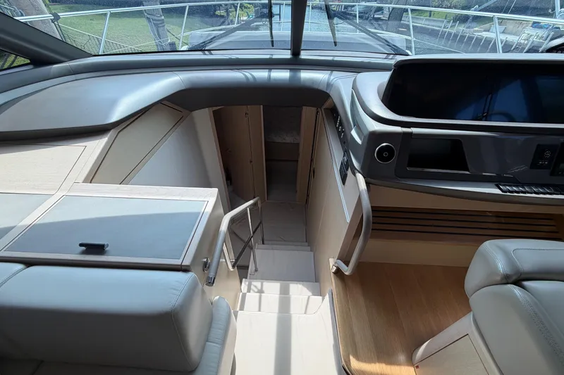 Slide: The Image of Interior of a 2018 Princess F55 yacht, featuring modern helm and luxurious design. - 27