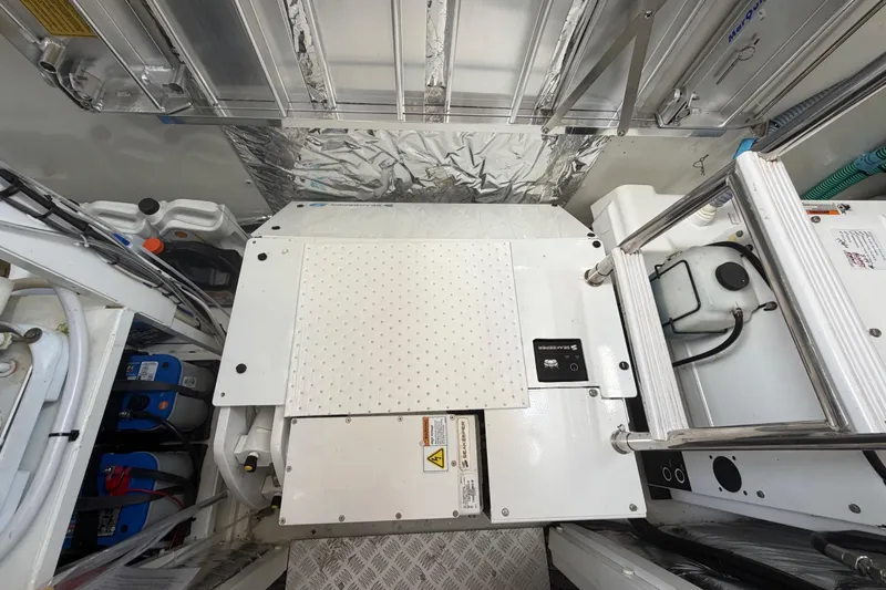 Slide: The Image of Engine room of a 2018 Princess F55 yacht, showcasing mechanical components and equipment. - 31