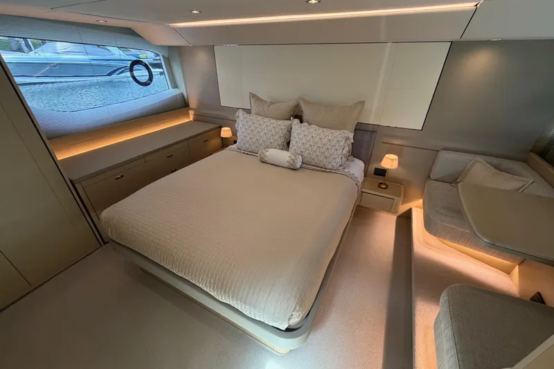 Slide: The Image of Luxurious bedroom interior of 2018 Princess F55 yacht with elegant furnishings and ambient lighting. - 16
