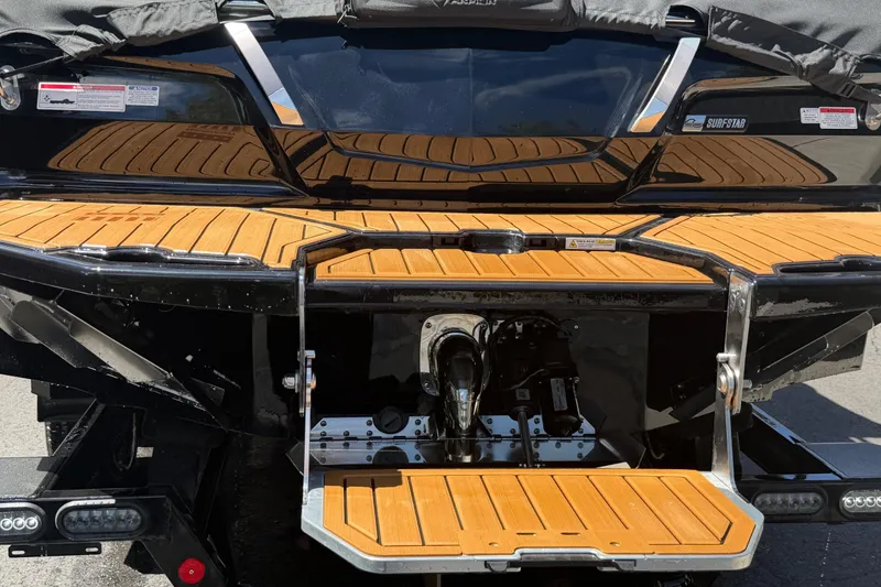 Slide: The Image of 2024 MasterCraft X24 boat stern with teak swim platform and SurfStar system. - 7