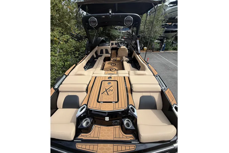 Slide: The Image of The image shows a luxurious 2024 MasterCraft X24 boat with elegant seating and modern design. - 8