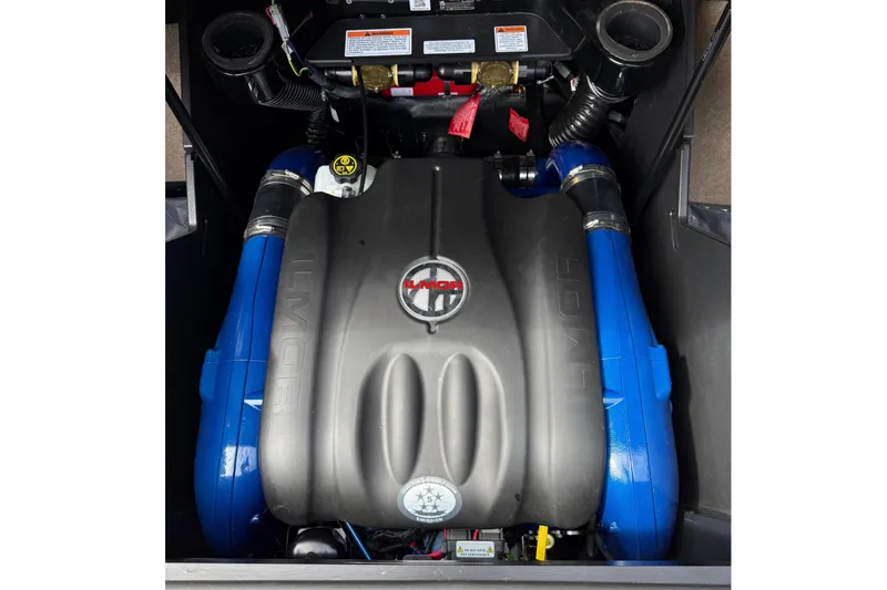 Slide: The Image of The engine compartment of a 2024 MasterCraft X24 features a powerful engine with blue accents. - 17