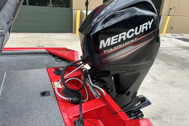 Slide: The Image of 2015 Tracker Pro Team 175 TXW boat with Mercury FourStroke engine, red and gray deck. - 14