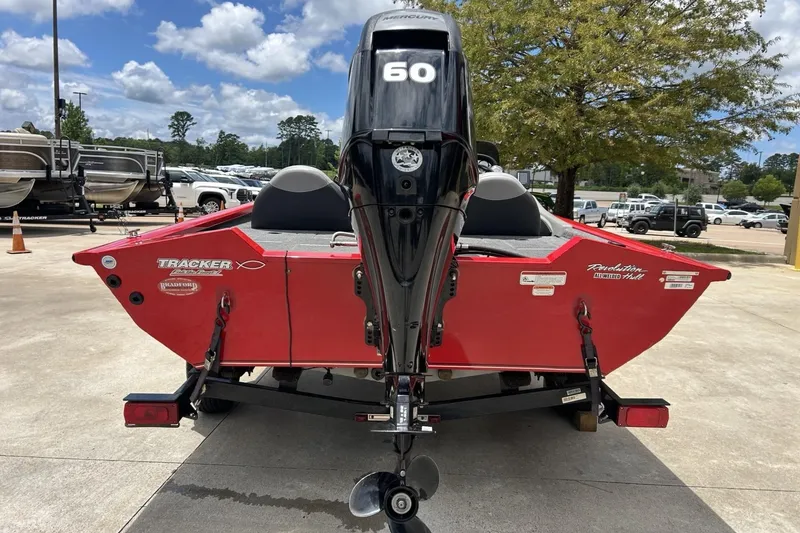 Slide: The Image of 2015 Tracker Pro Team 175 TXW boat with Mercury 60 engine, parked outdoors. - 8