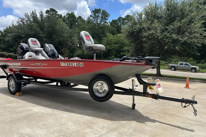 Slide: The Image of 2015 Tracker Pro Team 175 TXW boat on trailer, parked outdoors. - 11