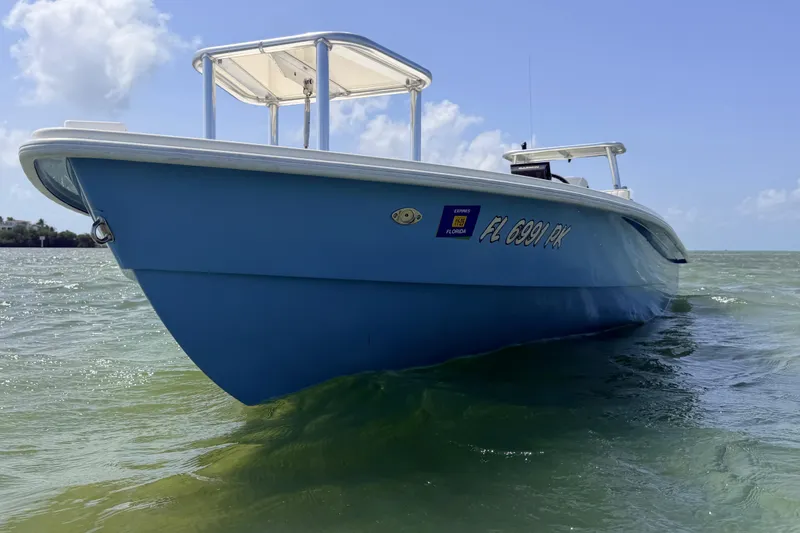 Slide: The Image of 2013 Hell's Bay Biscayne boat on water, clear sky background. - 20