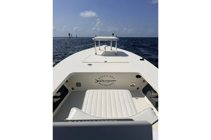 Slide: The Image of 2013 Hell's Bay Biscayne boat on open water under clear sky. - 27