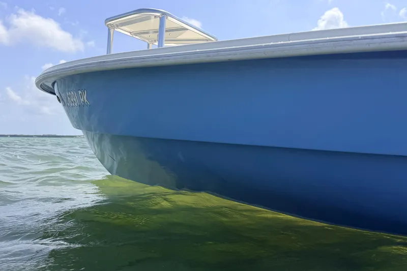 Slide: The Image of 2013 Hell's Bay Biscayne boat on clear water under a sunny sky. - 22