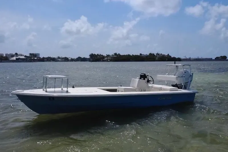 The Image of 2013 Hell's Bay Biscayne boat on calm water under a clear sky. - 0