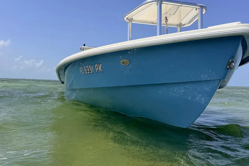 Slide: The Image of 2013 Hell's Bay Biscayne boat on clear water under blue sky. - 18