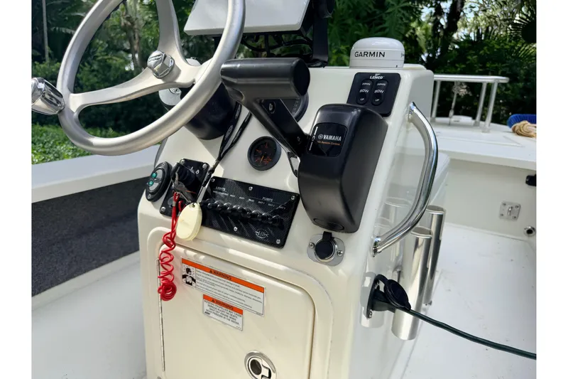 Slide: The Image of 2013 Hell's Bay Biscayne boat console with Garmin GPS and Yamaha controls. - 36