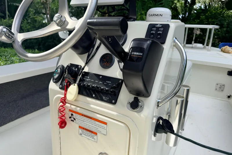 Slide: The Image of 2013 Hell's Bay Biscayne boat console with Yamaha controls and Garmin device. - 30
