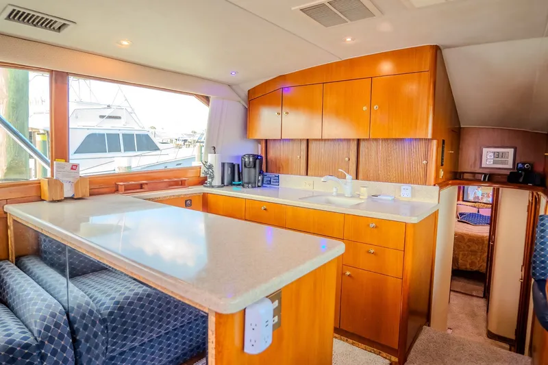 Slide: The Image of Interior of 2000 Ocean Yachts 48 Super Sport with modern kitchen and seating area. - 27