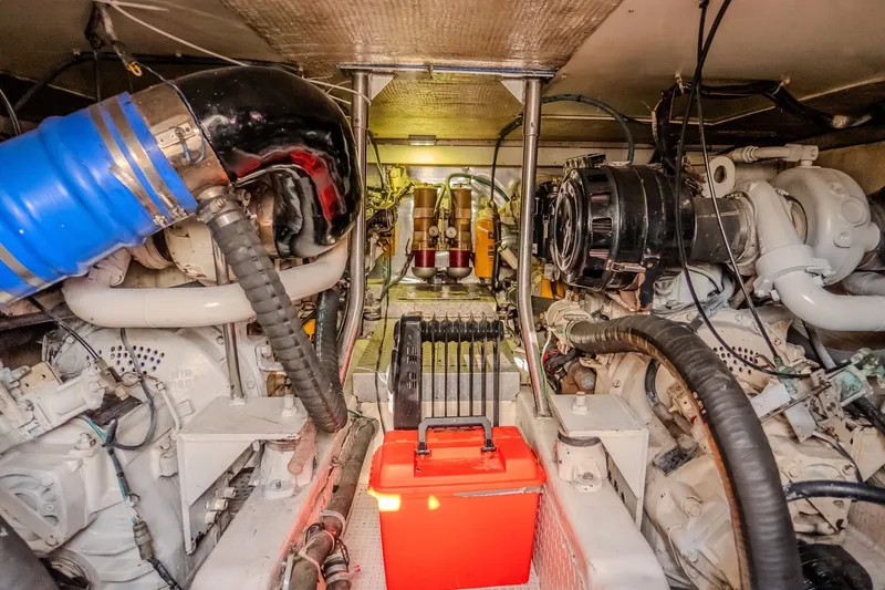 Slide: The Image of Engine room of 2000 Ocean Yachts 48 Super Sport, showcasing mechanical components and equipment. - 37