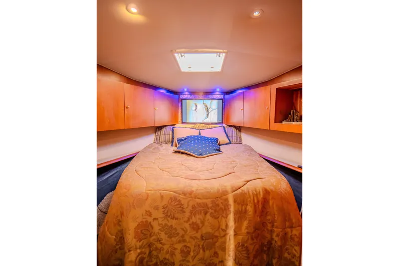 Slide: The Image of Luxurious cabin interior of 2000 Ocean Yachts 48 Super Sport with cozy bedding. - 29