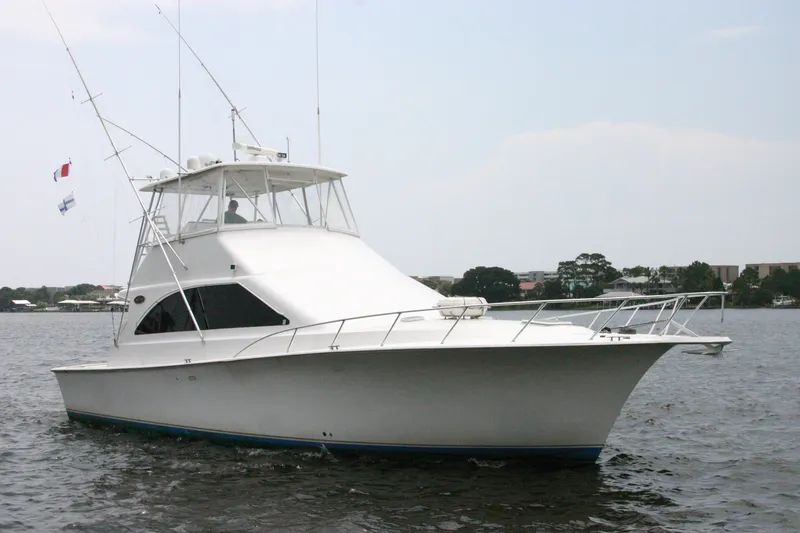 Slide: The Image of 2000 Ocean Yachts 48 Super Sport cruising on calm waters. - 8