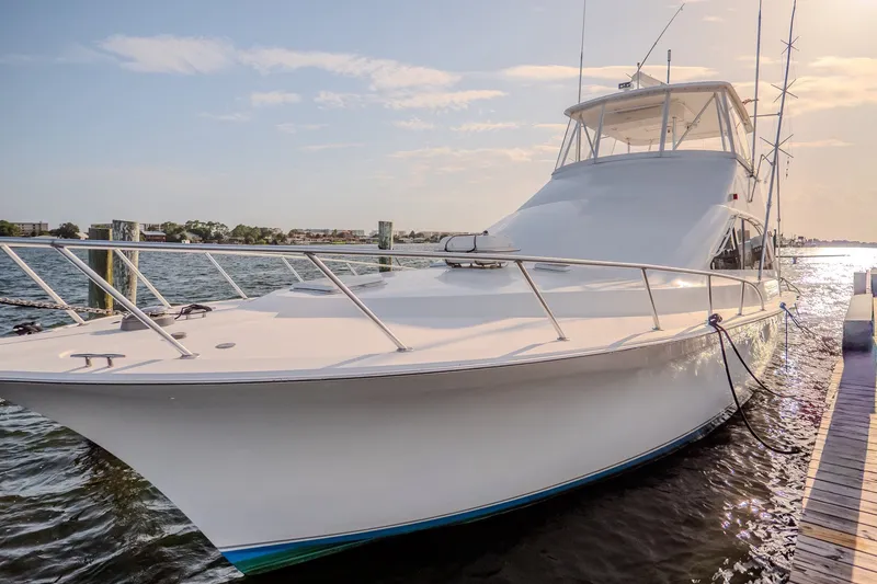 Slide: The Image of 2000 Ocean Yachts 48 Super Sport docked on a sunny day. - 10