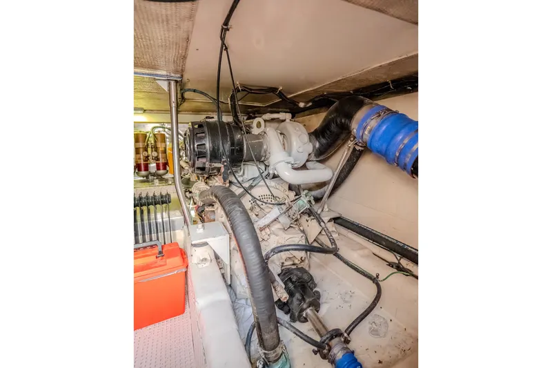 Slide: The Image of Engine room of 2000 Ocean Yachts 48 Super Sport, showcasing mechanical components. - 38