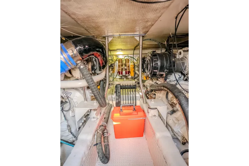 Slide: The Image of Engine room of 2000 Ocean Yachts 48 Super Sport, showcasing mechanical components and wiring. - 39