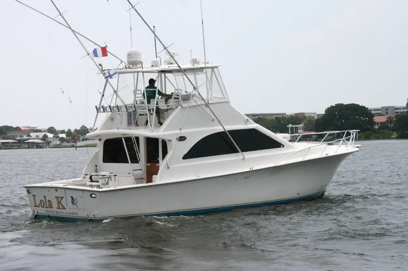 Slide: The Image of 2000 Ocean Yachts 48 Super Sport boat cruising on a calm waterway. - 1