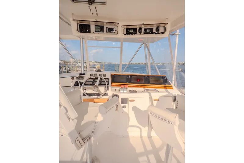 Slide: The Image of Helm of 2000 Ocean Yachts 48 Super Sport with ocean view and navigation equipment. - 18