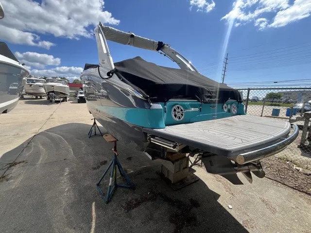 Slide: The Image of A 2024 Regal LS6 boat is on a dry dock under a blue sky. - 26