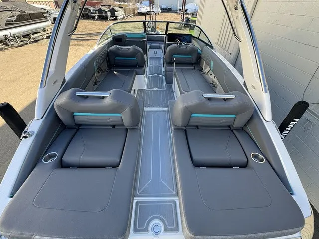 Slide: The Image of The image shows the interior of a 2024 Regal LS6 boat with gray seating and blue accents. - 15